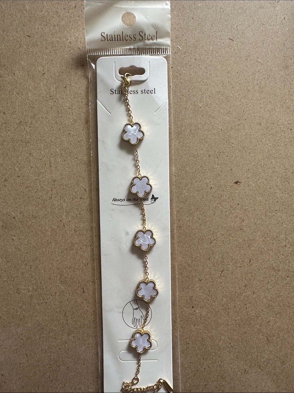 Gold Stainless Steel Bracelet with White Clover Charms
